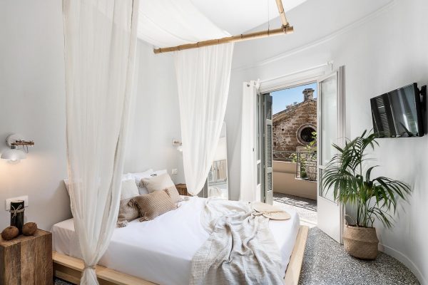 Hotel bedroom interior with balcony view