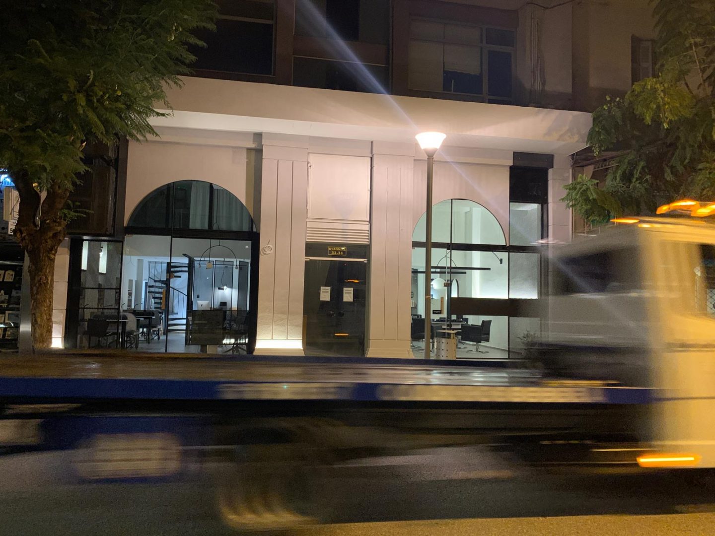 Nail salon facade at night